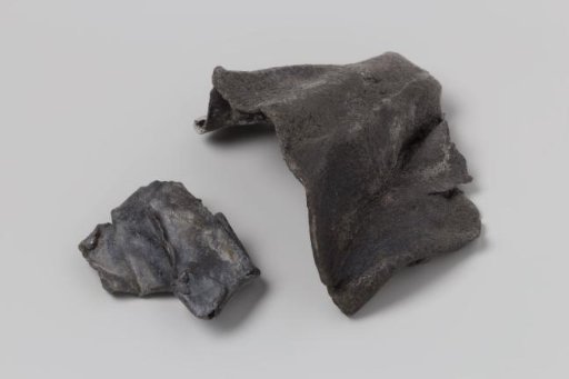 Fragments of a lead sheet from the wreck of the East Indiaman 't Vliegend Hart