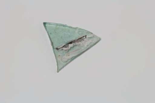 Shard of a cellar bottle, window pane or lantern from the wreck of the East Indiaman 't Vliegend Hart, lost in 1735