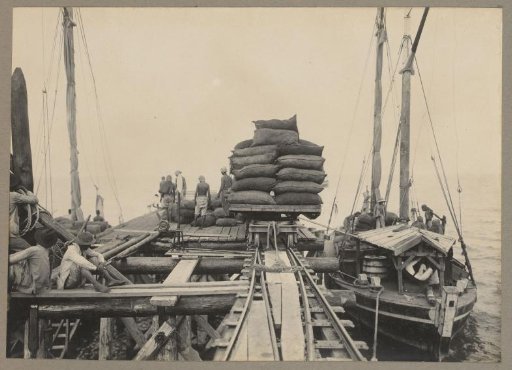 Unloading of charcoal at the pier