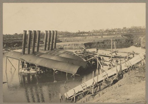 Dredging pump underwater after the 1914 breach of mine 43 Soengeiliat