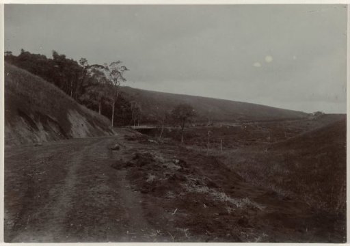 Construction of the road with a bridge along a slope