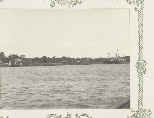 Houses and Ships Along a River