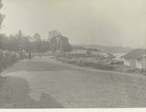 Road through a village by the water
