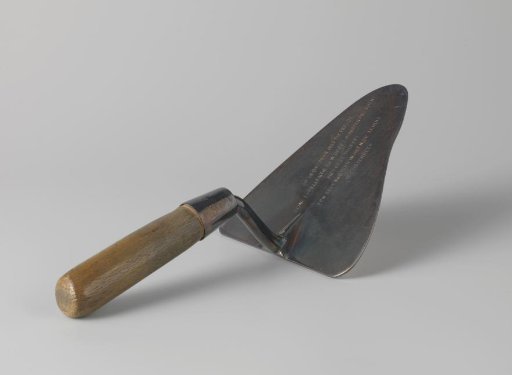 Silvered trowel with which Prime Minister Dr. W. Drees laid a commemorative stone in the NOV home in Oosterbeek on 28 October 1955
