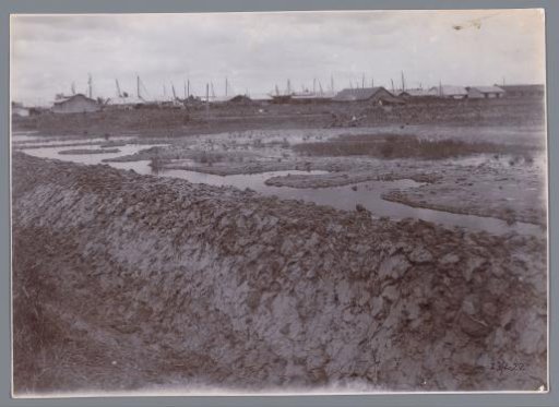 Constructing Press Dikes Around the Housing Quarter to Be Sprayed