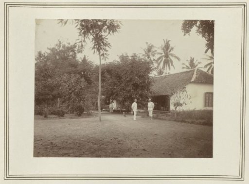 Two Men Before a House
