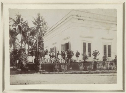 Group photograph in front of a house