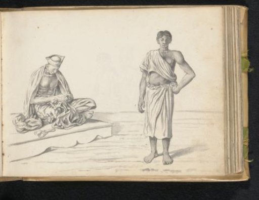 A man standing next to a tailor at work