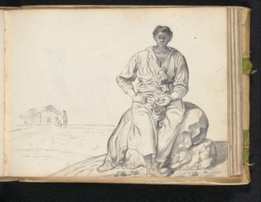 Woman sitting on a boulder