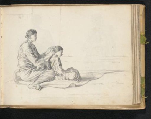 Woman combing a young girl's hair