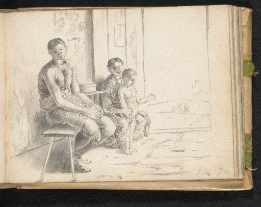 Man, woman and little boy, inside the house