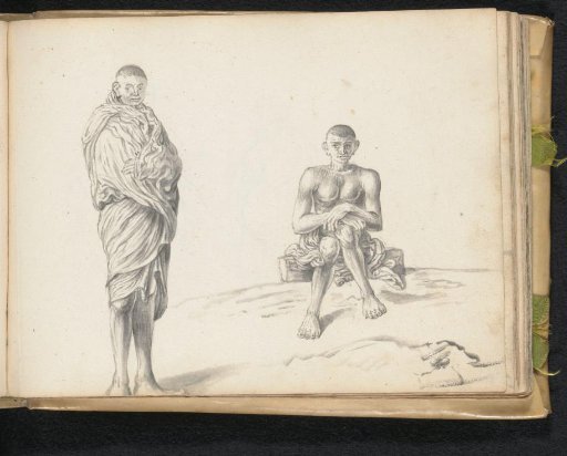Two labourers outside, one standing and one sitting