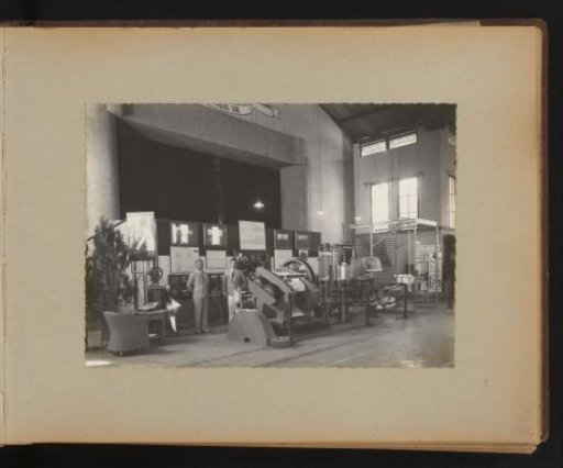 Men Posing in the Factory at an Exhibition of Machines