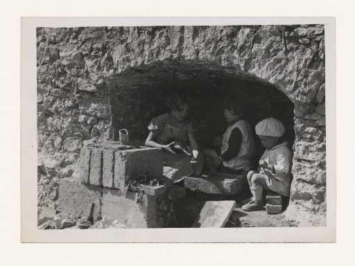 Children play in the rubble