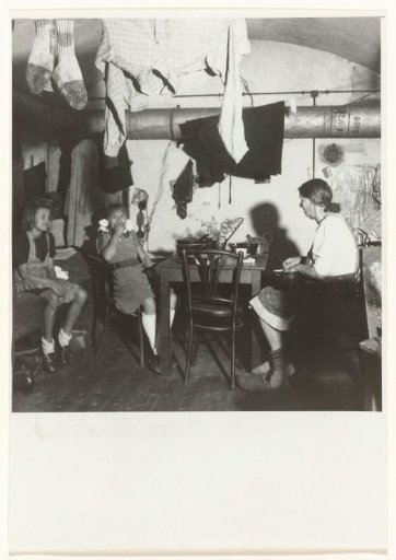Two Children and a Woman in an Interior