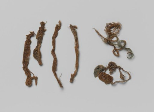 Fragments of textile belonging to a coat