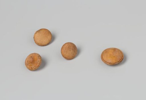 Four buttons belonging to a coat