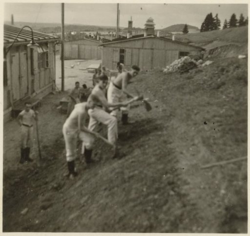 Three men digging