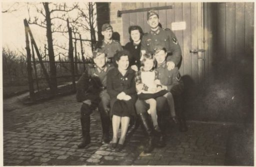 Group photo with German soldiers and women