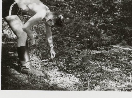 Soldier in swimming trunks and boots
