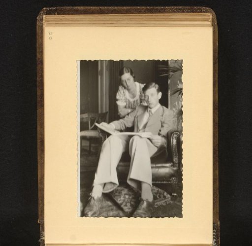 Seated Man in a Chair with a Standing Woman