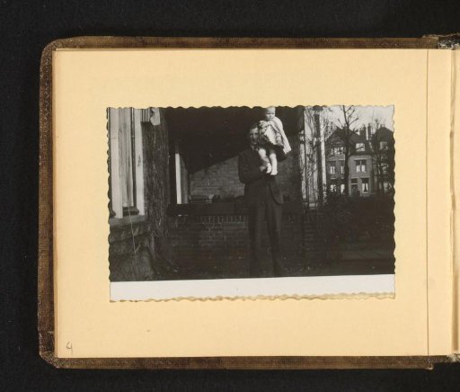 Man with child on shoulder