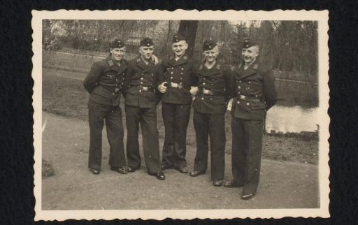 Five sailors in a park