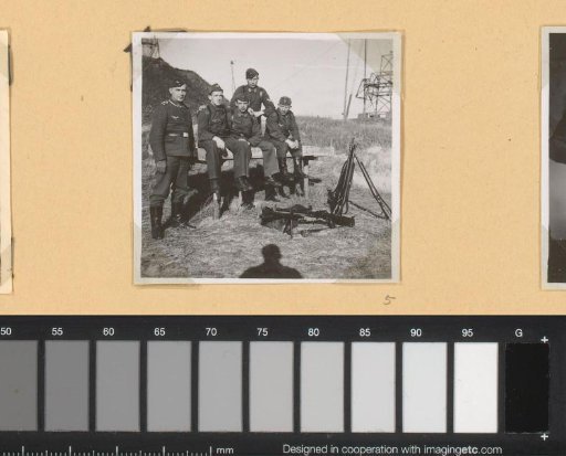 Five soldiers in front of the bunker