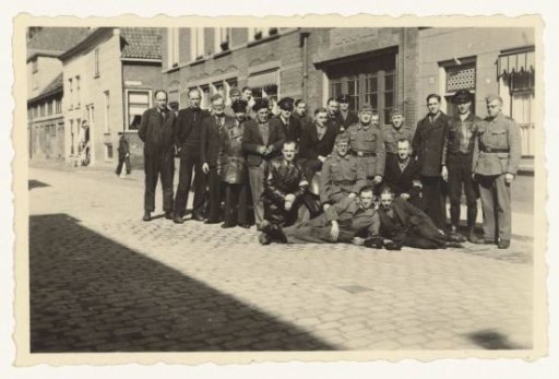 Group of men, partly in uniform