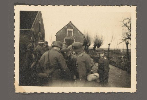 Group of soldiers near dwellings