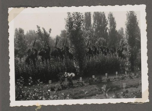 Salute during the burial of three fallen soldiers