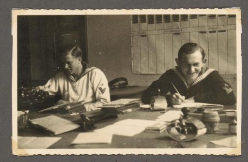 Two Soldiers at a Desk