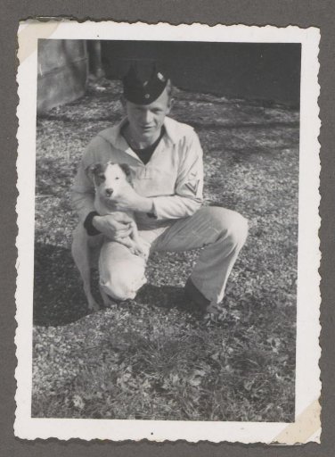 Portrait of a Soldier in Uniform with a Dog