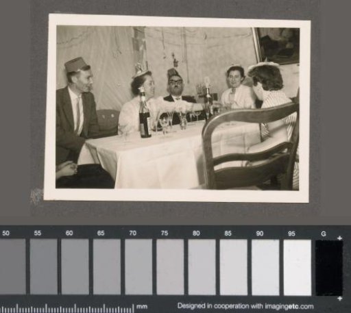 Men and women at a table at a party