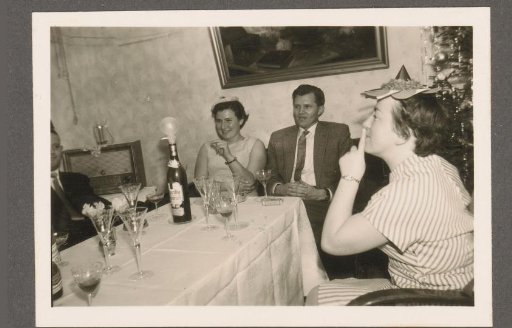 Men and women at a table at a party