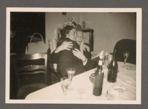 Man and woman at a table at a party