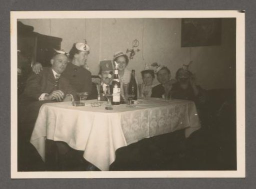 Men and women at a table at a party