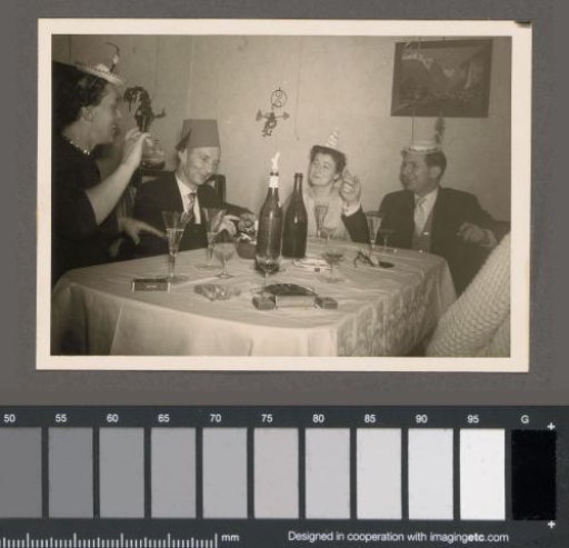 Men and women at a table at a party