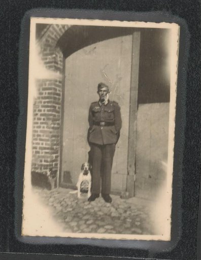 Soldier in Uniform with a Dog