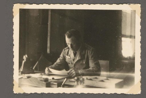 Ob. Wm. Meyer behind a desk