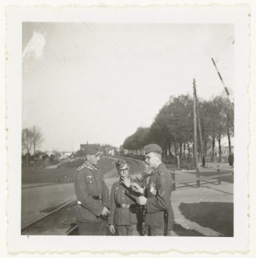 Wehrmacht soldiers at a station