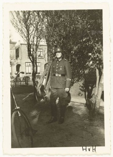 Wehrmacht Soldier in Front of a House
