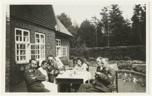 Luftwaffe soldiers sitting outside at a table