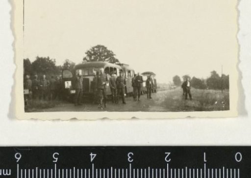 German soldiers by two buses