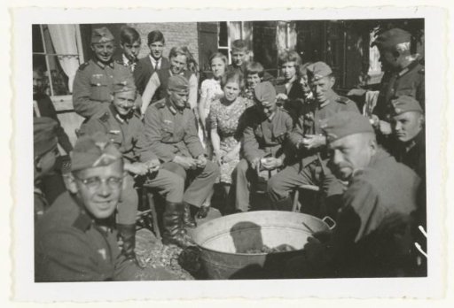 German soldiers peeling potatoes.