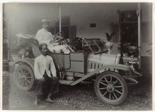 Mr. Letterie in his car with servant in front of his home in Mojosari
