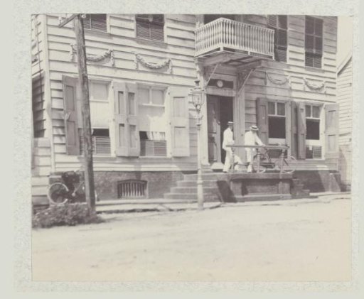 Two Men in Front of a Building