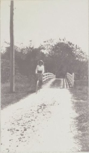 Maria Gonggrijp on a bicycle