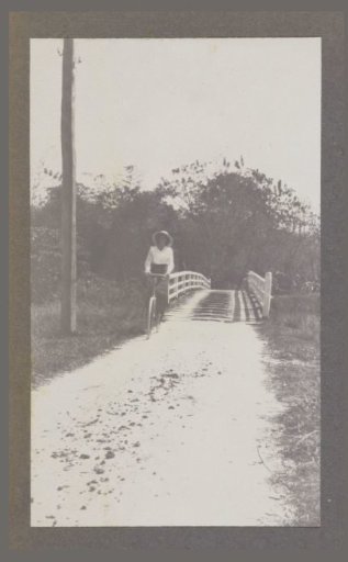 Maria Gonggrijp on a bicycle