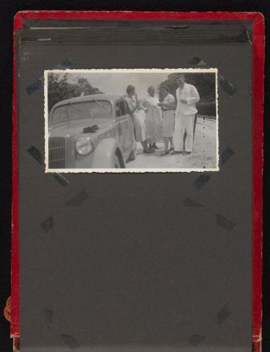 People by a car
